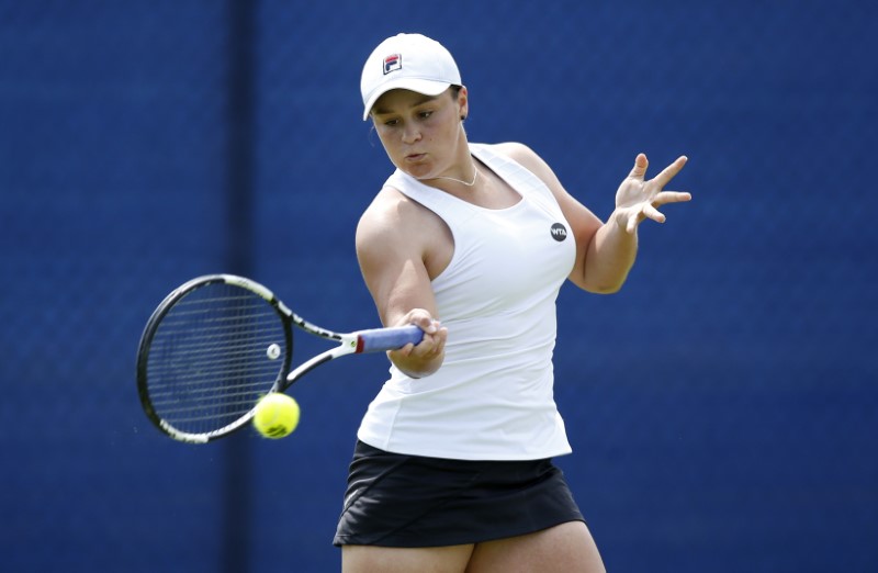 Tennis: Former cricketer Barty puts runs on the board in return