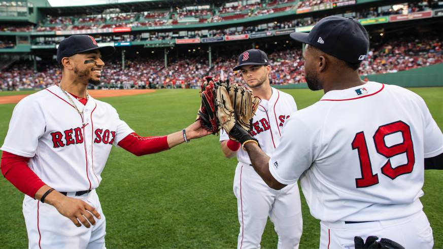 Andrew Benintendi Boston Red Sox Unsigned Celebration with Jackie Bradley Jr. and Mookie Betts Photograph