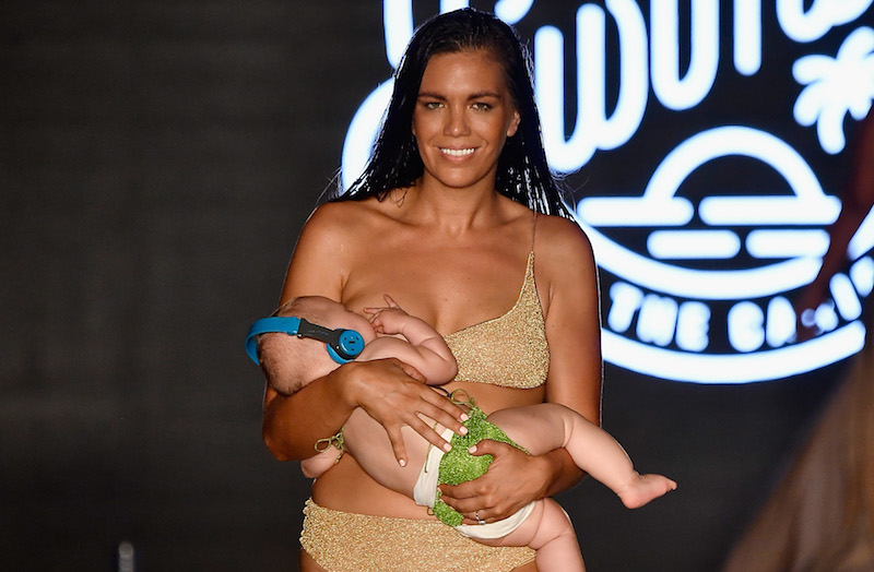 This Sports Illustrated model mama breastfeeding on the catwalk is