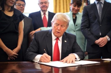 So many executive orders, so few pens for President Trump