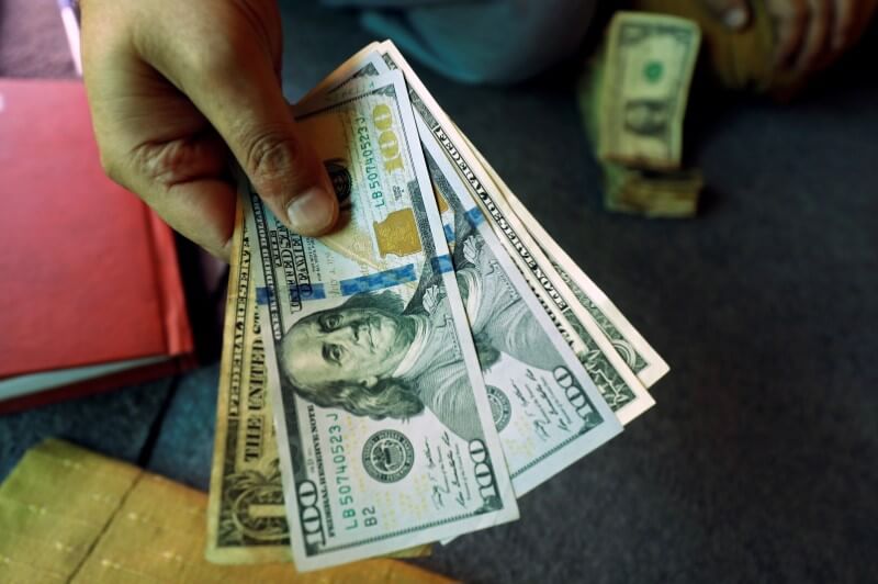 Dollar steady as coronavirus contagion fears abate