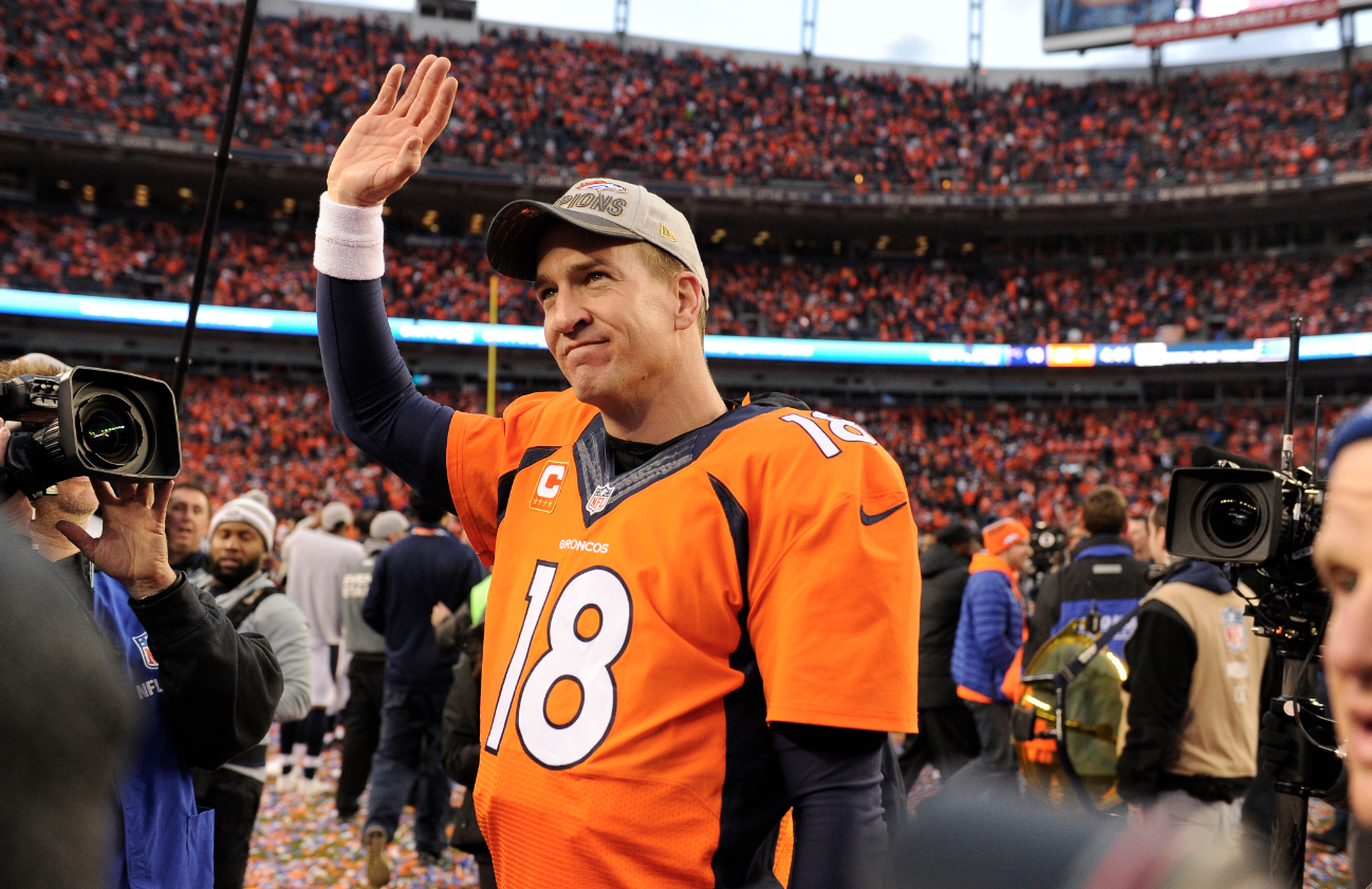 Former Broncos quarterback Peyton Manning fires up Coors Field on jumbotron