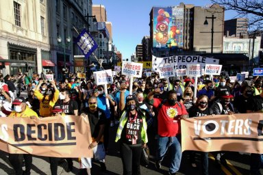 People march as they celebrate media announcing that Democratic U.S. presidential nominee Joe Biden has won the 2020 U.S. presidential election, in Philadelphi