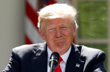 FILE PHOTO: U.S. President Trump pauses as he announces his decision to withdraw from Paris Climate Agreement at White House in Washington