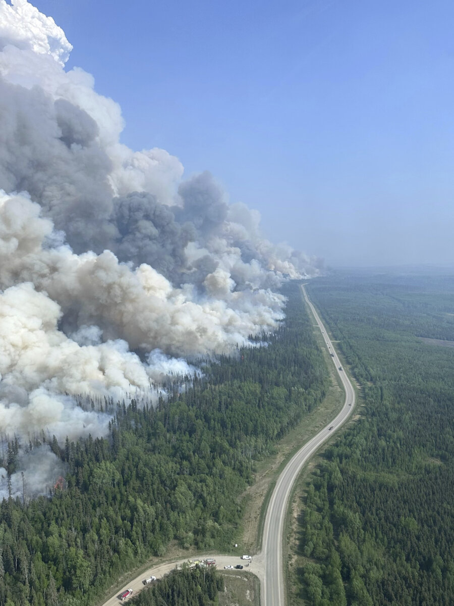 Rain, even smoke help fight wildfires in Alberta; new blaze brings