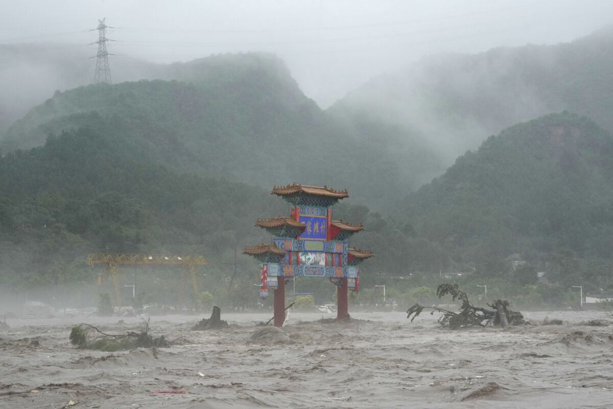 Floods around Chinese capital kill at least 20, leave 27 missing as