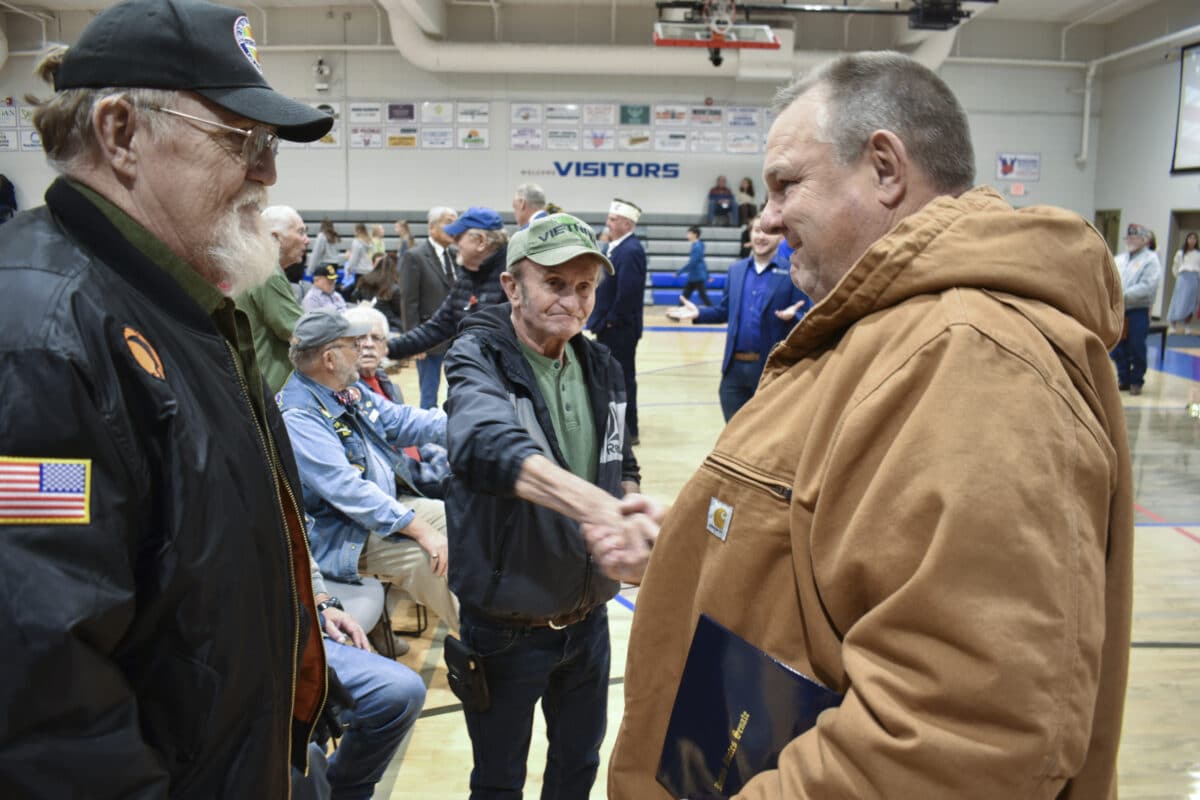 A Montana farmer with a flattop and ample lobbyist cash stands between