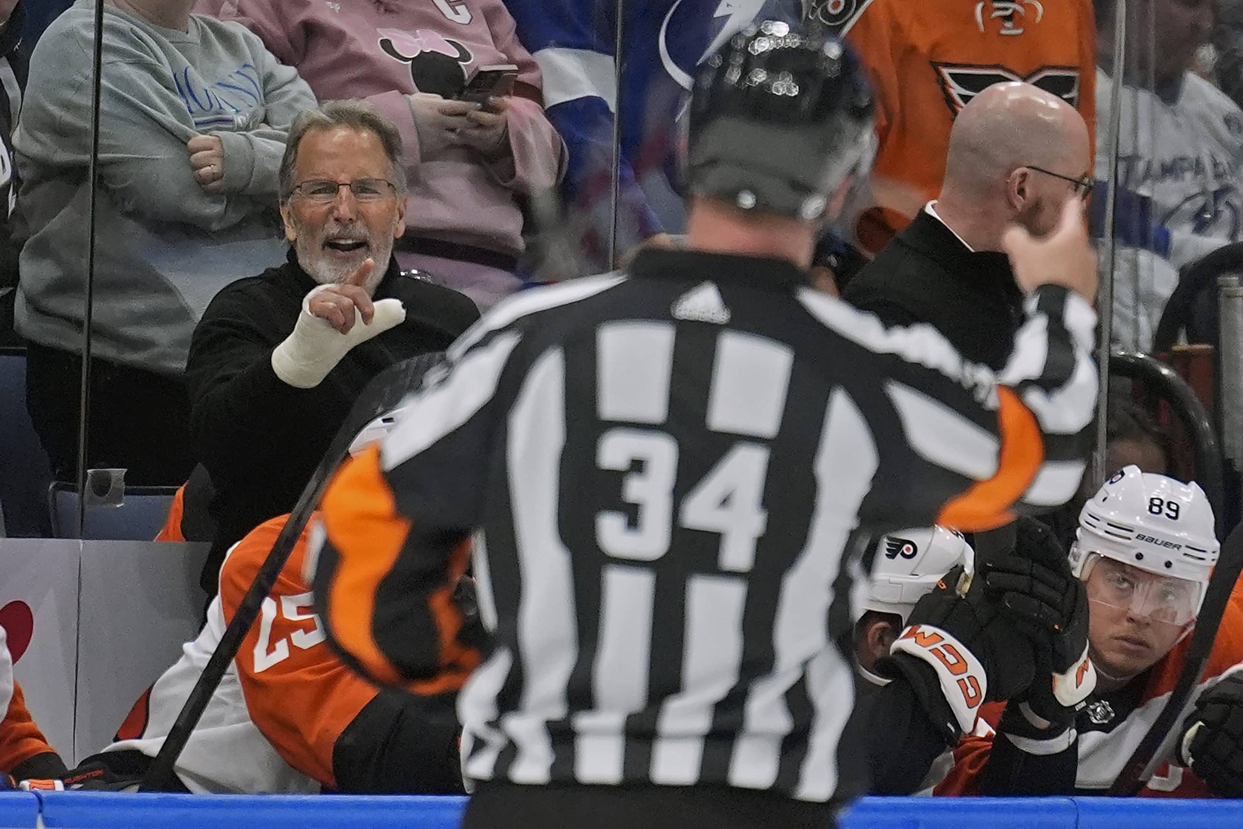 Flyers coach John Tortorella reluctantly leaves bench after being
