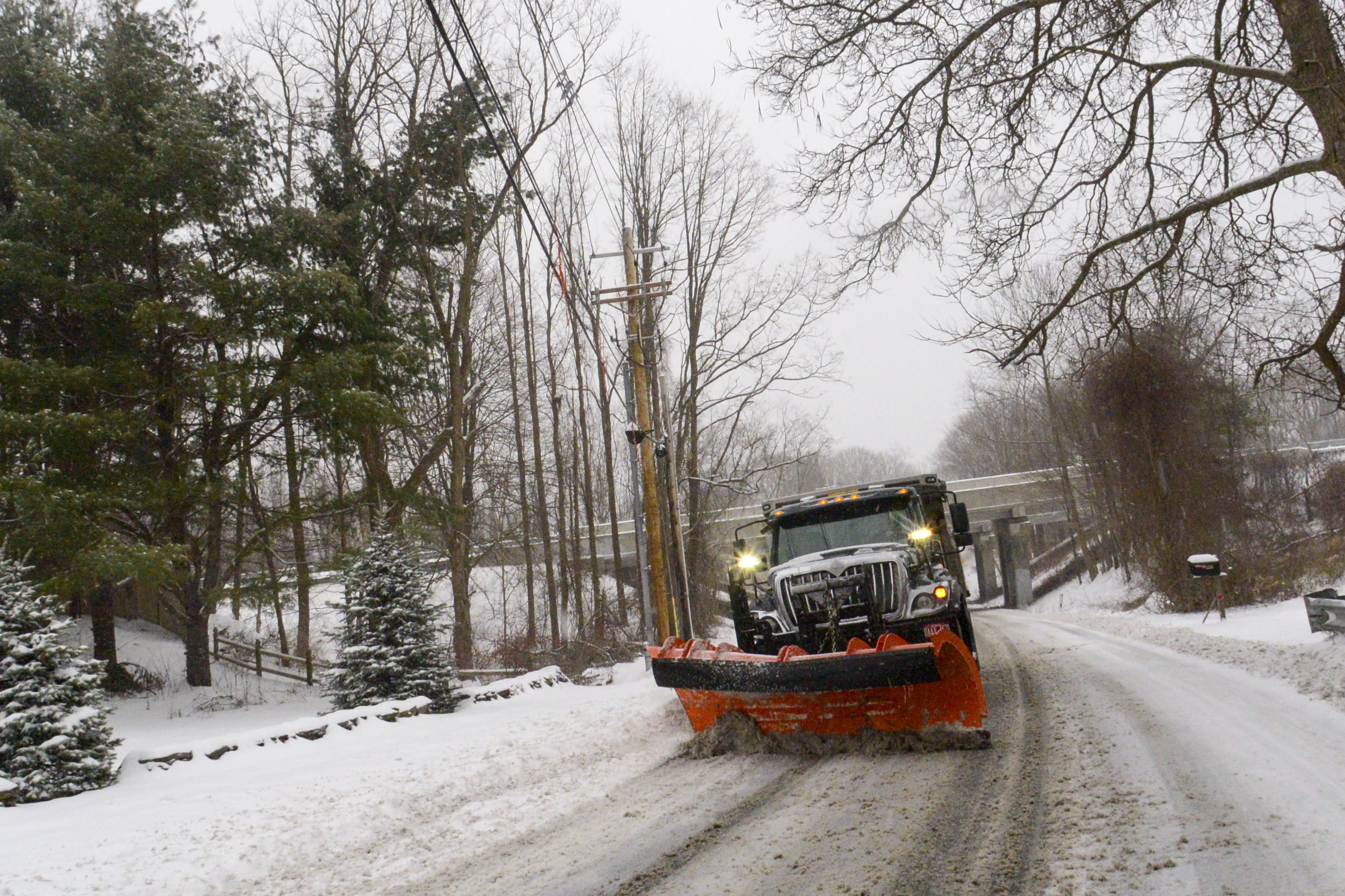 Wintry weather blankets New England and California mountains as storm
