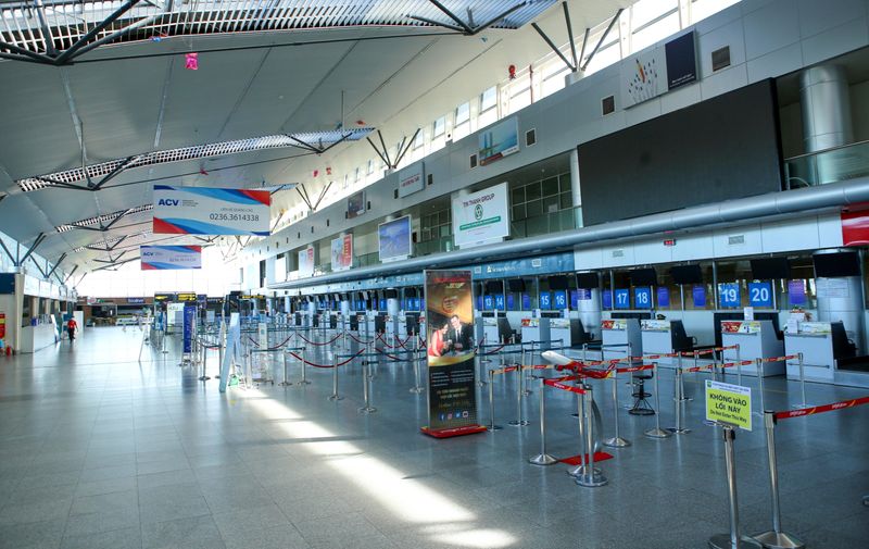 Empty check-in counters are seen at Da Nang airport, as