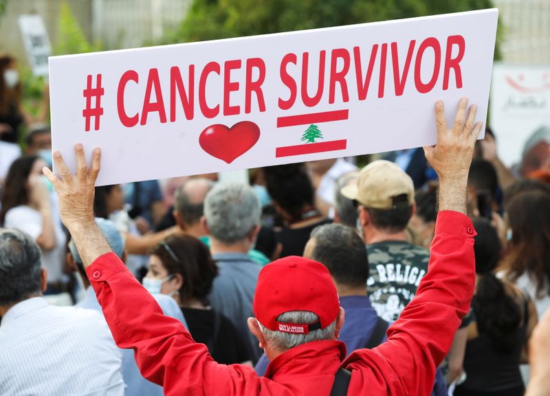 A man holds a sign during a sit-in demonstration as