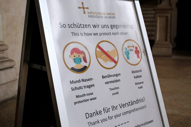 Health protection info sign is seen at a church entrance