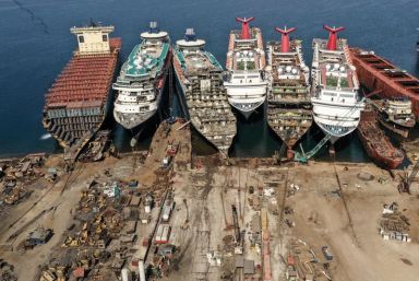 A drone image shows decommissioned cruise ships being dismantled at