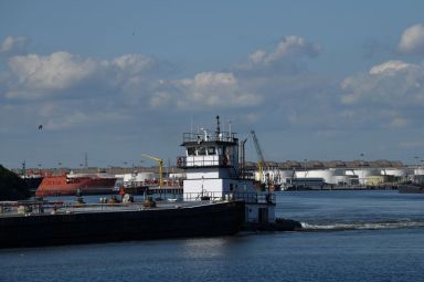 FILE PHOTO: A barge travels through the Houston Ship Channel,