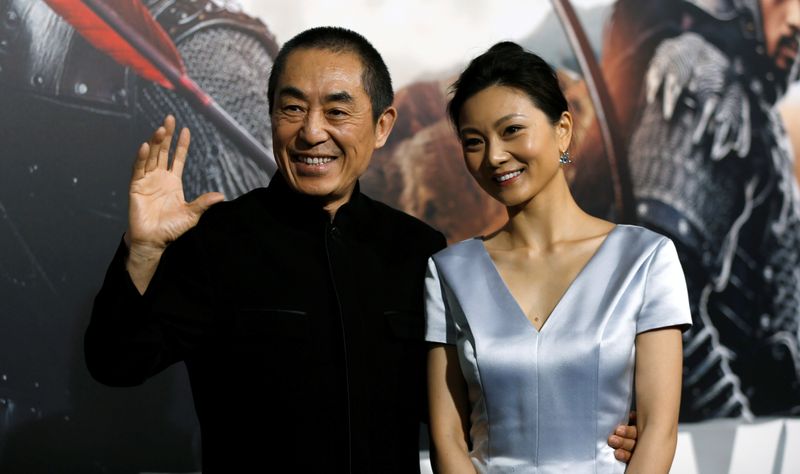 Director of the movie Zhang and his wife pose at