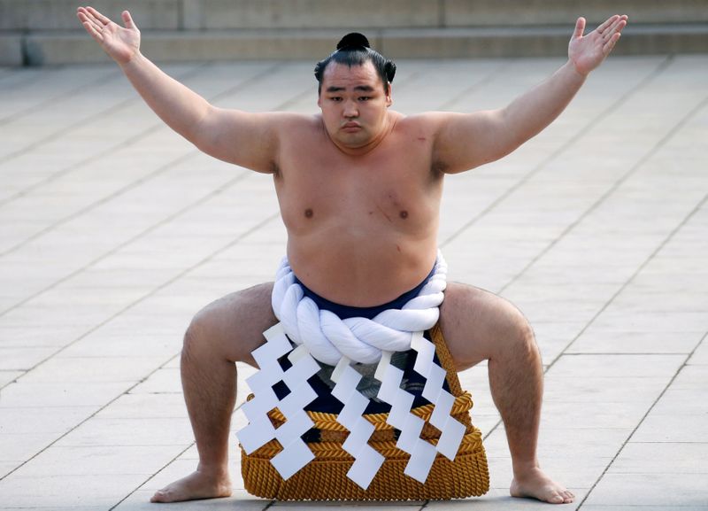 Mongolian-born grand sumo champion Yokozuna Kakuryu performs the New Year’s