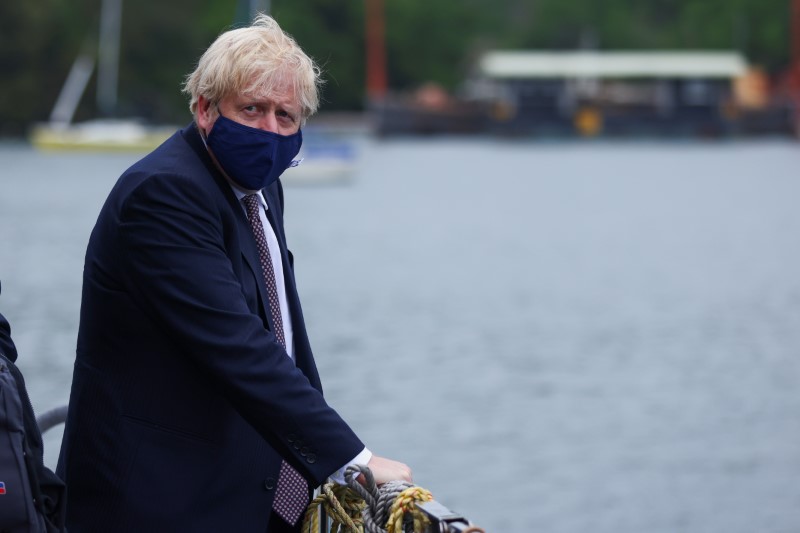 Britain’s PM Johnson visits the workshop of Scott Woyka, in