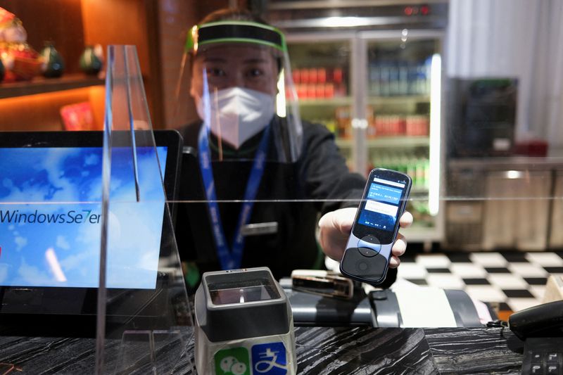Chinese restaurant uses translation device to speak to foreign Olympics