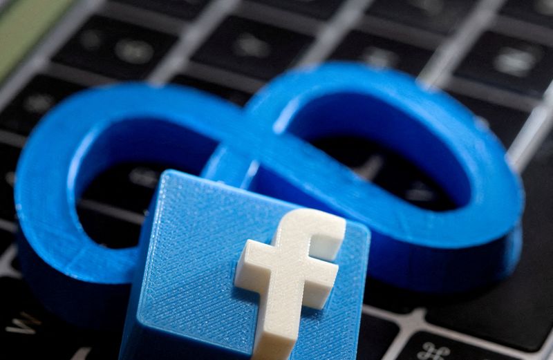 3D-printed images of Facebook’s logo and Meta Platforms seen on