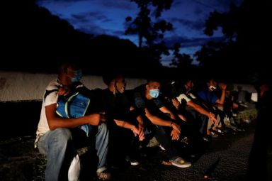 Honduran migrants trying to reach the U.S. rest on a