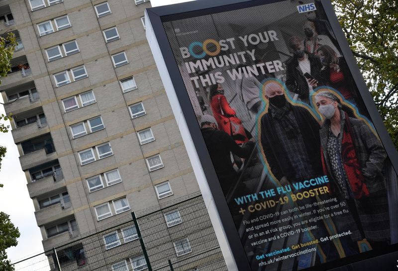 An NHS COVID-19 vaccination health campaign advertisement is displayed near