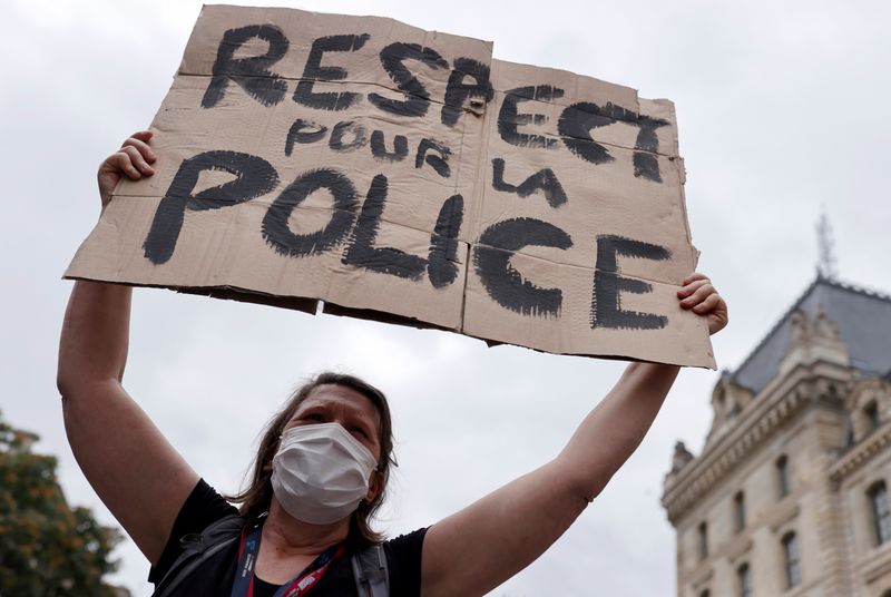 A supporter of police forces wearing a protective face mask