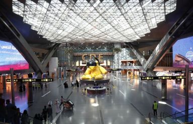 People are seen at Hamad International Airport, as the country