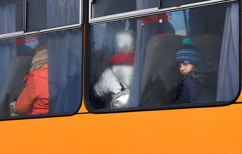 Refugees arrive at the Polish border town of Moszczany near